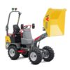 Dumper articulado con tolva elevable para transporte de áridos en obra.